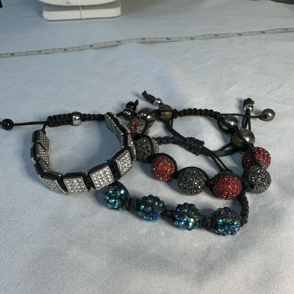 Three sparkly adjustable bracelets